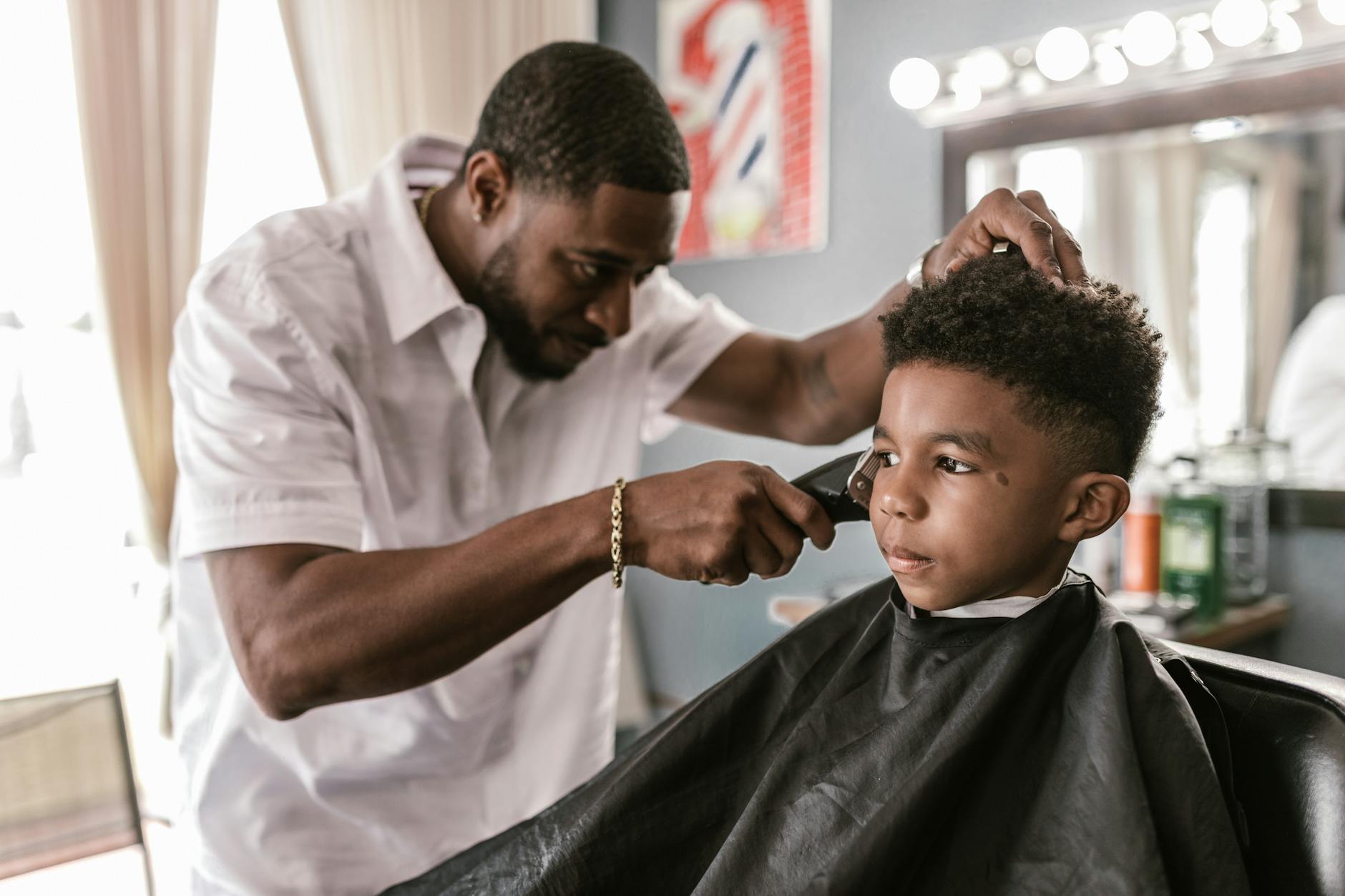 Father and son at the barber shop, family-friendly atmosphere